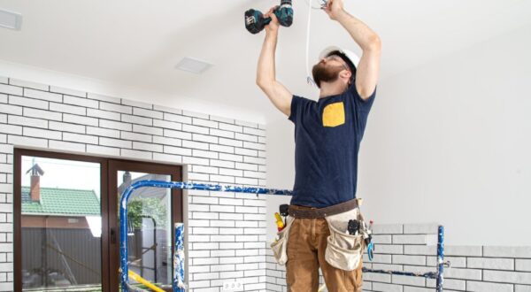 electrician-builder-work-installation-lamps-height-professional-overalls-with-drill-repair-site-1024x691